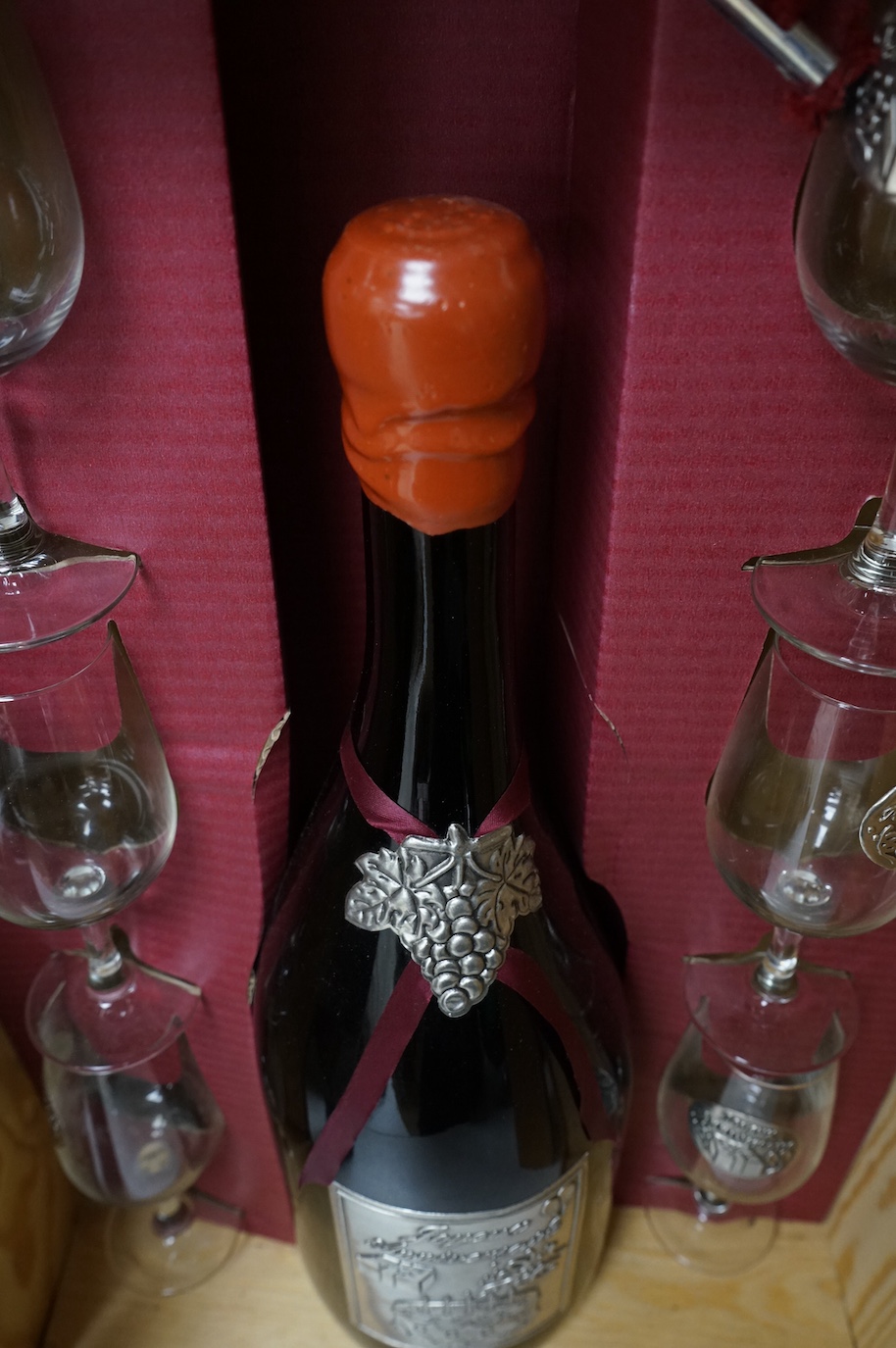 One bottle of Kummel, another, Tokaji, and a Joyeux Anniversaire, cased